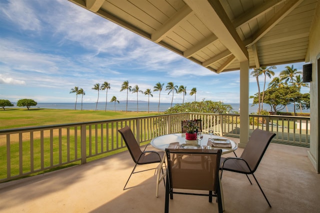 view of patio / terrace with a water view and outdoor dining space