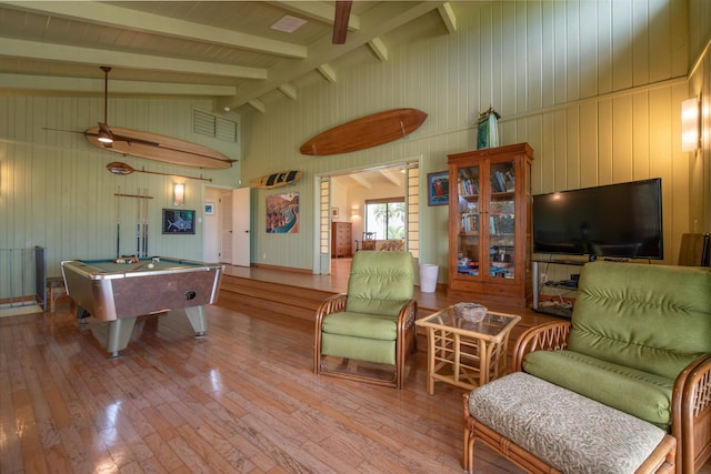 rec room with vaulted ceiling with beams, billiards, wood-type flooring, and wooden walls