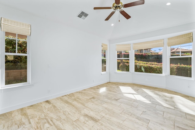 spare room featuring ceiling fan and vaulted ceiling