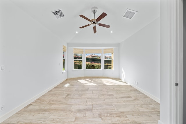 spare room with vaulted ceiling and ceiling fan