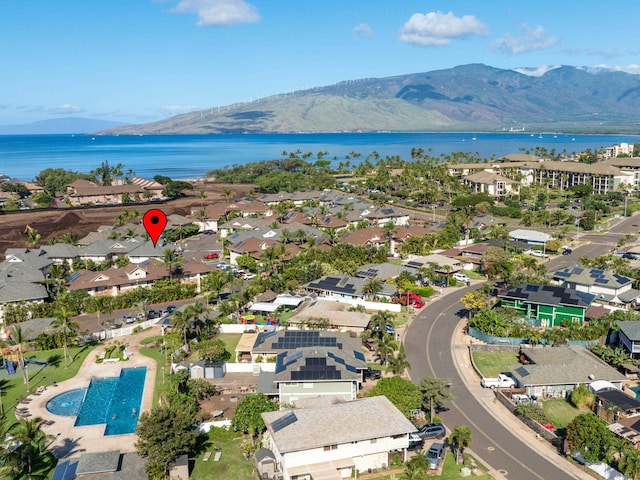 birds eye view of property featuring a residential view and a water and mountain view