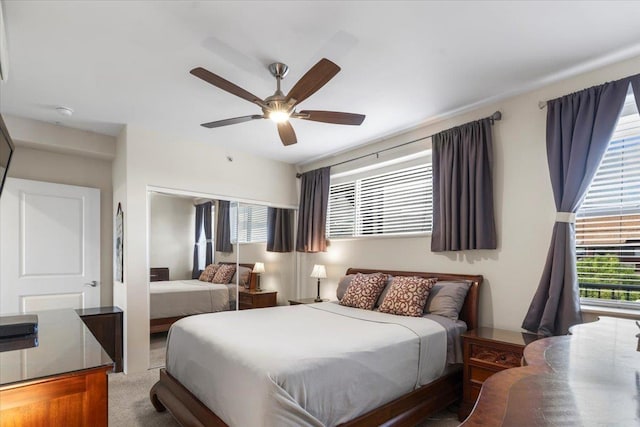 carpeted bedroom with ceiling fan