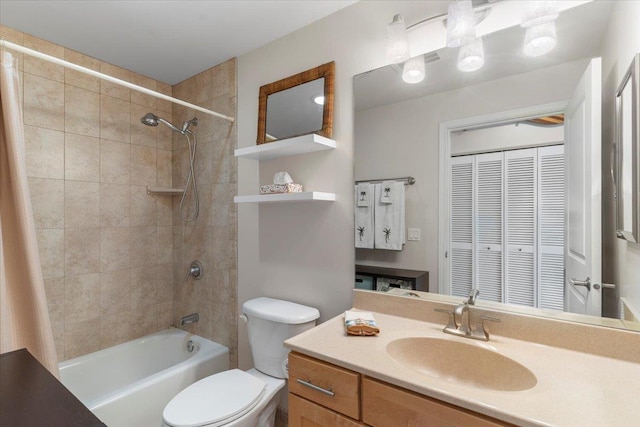 full bathroom featuring vanity, toilet, and tiled shower / bath combo