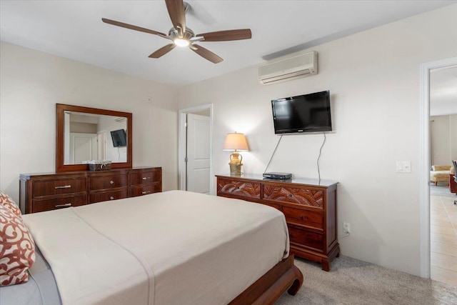 tiled bedroom with ceiling fan and an AC wall unit