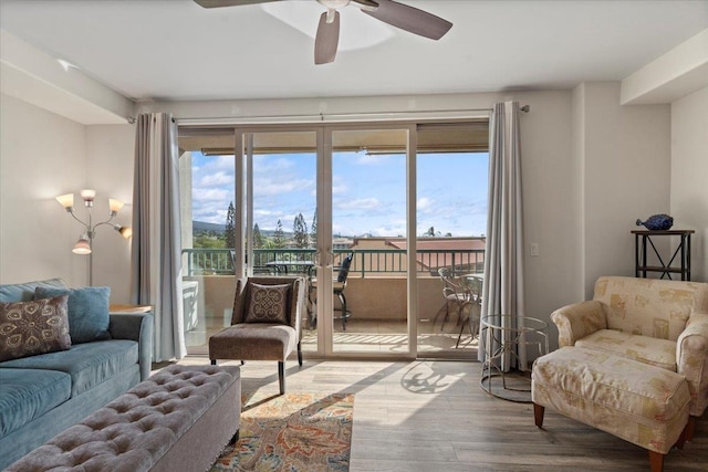 living room with wood-type flooring, french doors, and ceiling fan