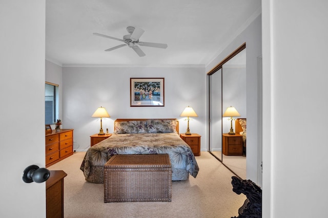 bedroom featuring baseboards, crown molding, and light colored carpet