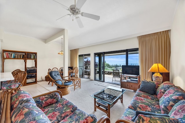 carpeted living area with a ceiling fan