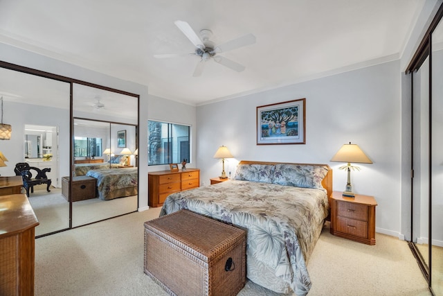 bedroom featuring a closet, a ceiling fan, light colored carpet, and baseboards