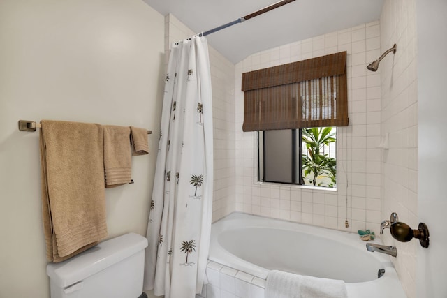 full bathroom with toilet and tiled shower / bath