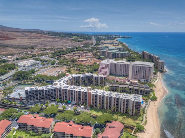 aerial view with a water view and a beach view