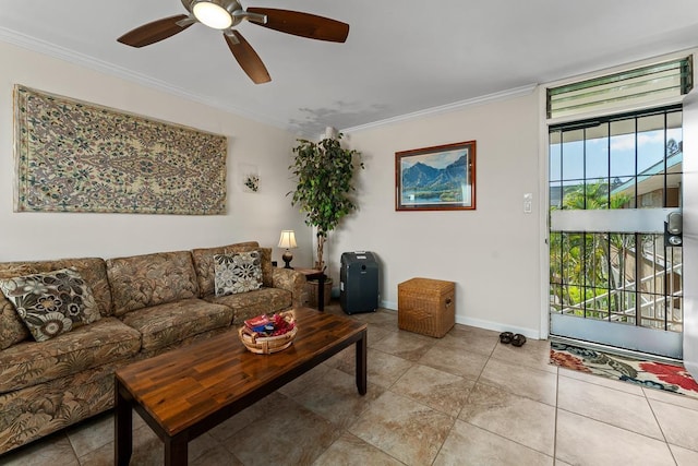 living area with light tile patterned floors, baseboards, ornamental molding, and ceiling fan