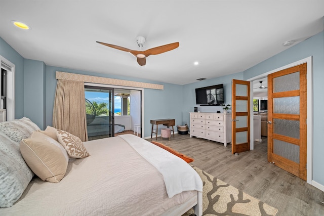 bedroom with a ceiling fan, access to exterior, wood finished floors, and baseboards