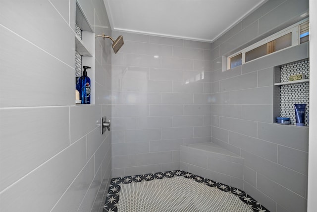 bathroom with tiled shower