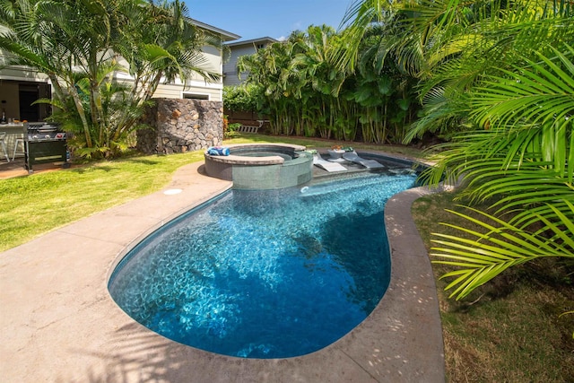 pool featuring a patio and an in ground hot tub