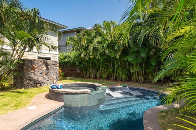 view of swimming pool with a pool with connected hot tub