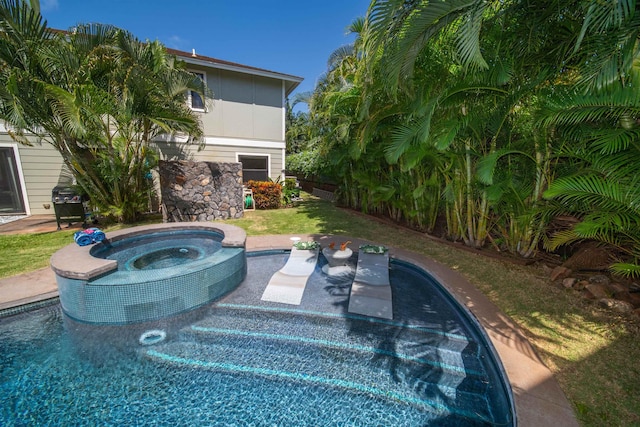 view of swimming pool featuring an in ground hot tub