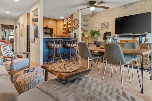 1299 Uluniu Rd Unit 103E, Kihei, HI 96753 - living room with ceiling fan, recessed lighting, and light wood-style floors