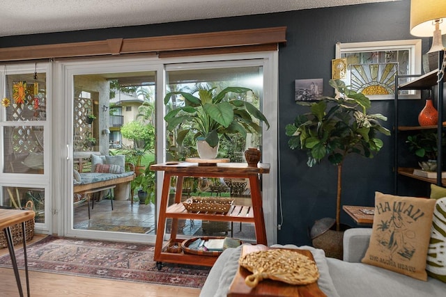 1299 Uluniu Rd Unit 103E, Kihei, HI 96753 - entryway with wood finished floors and a textured ceiling