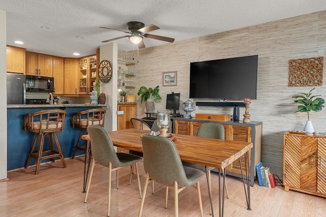 1299 Uluniu Rd Unit 103E, Kihei, HI 96753 - dining space with a ceiling fan, a textured ceiling, light wood-style floors, and recessed lighting