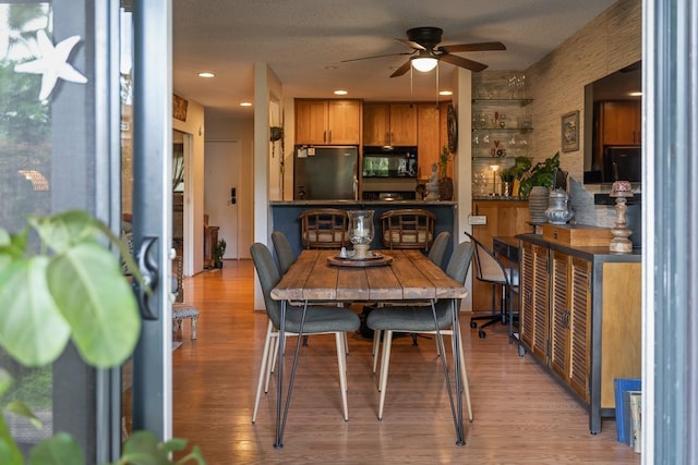 1299 Uluniu Rd Unit 103E, Kihei, HI 96753 - dining space featuring a ceiling fan, light wood-style flooring, and recessed lighting