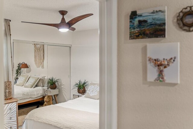 1299 Uluniu Rd Unit 103E, Kihei, HI 96753 - bedroom with a closet and ceiling fan