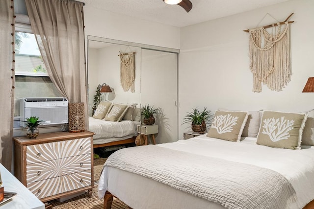 1299 Uluniu Rd Unit 103E, Kihei, HI 96753 - bedroom featuring a ceiling fan and a closet