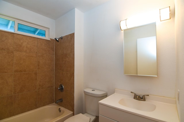 full bathroom featuring toilet, vanity, and tiled shower / bath