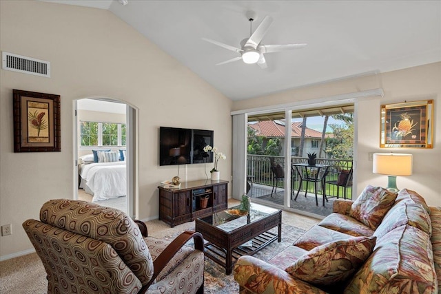 22 Kai Makani Loop Unit 201, Kihei, HI 96753 - living room with light colored carpet, plenty of natural light, a ceiling fan, high vaulted ceiling, and arched walkways