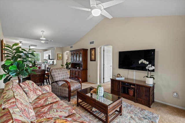 22 Kai Makani Loop Unit 201, Kihei, HI 96753 - living area with ceiling fan, light colored carpet, vaulted ceiling, and baseboards