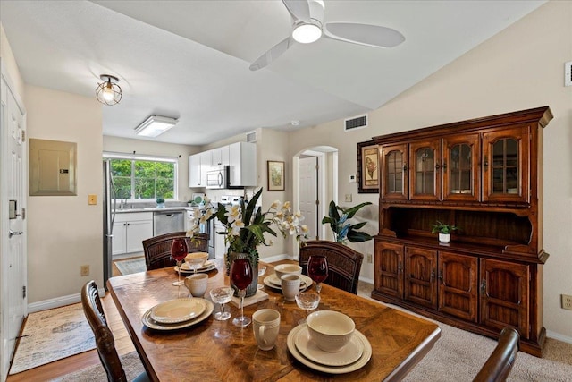 22 Kai Makani Loop Unit 201, Kihei, HI 96753 - dining area with electric panel, arched walkways, baseboards, and ceiling fan