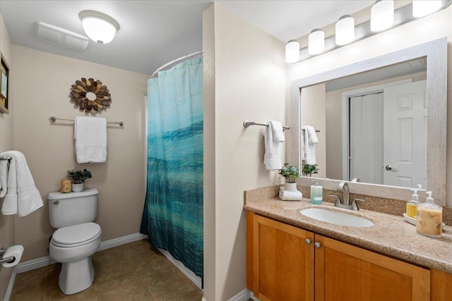 22 Kai Makani Loop Unit 201, Kihei, HI 96753 - full bathroom with toilet, vanity, baseboards, tile patterned flooring, and a shower with shower curtain