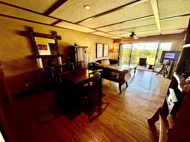 dining space featuring wood-type flooring and ceiling fan