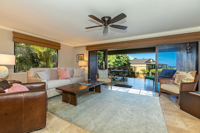 living room featuring a wealth of natural light, crown molding, and ceiling fan