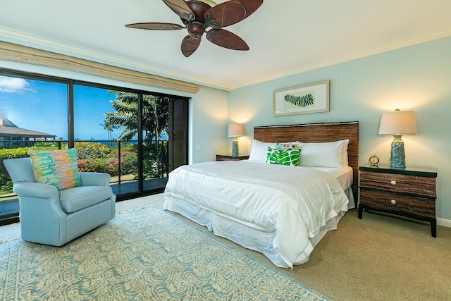 carpeted bedroom featuring ceiling fan, crown molding, and access to outside