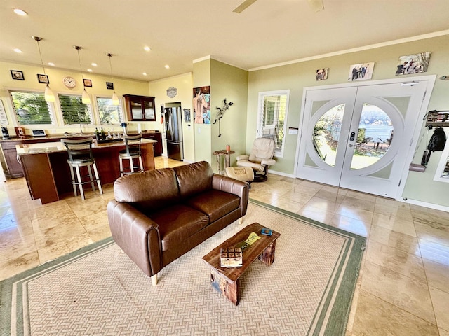 tiled living room featuring french doors and ornamental molding