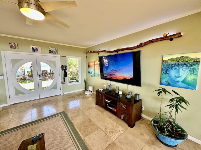 living room featuring crown molding, french doors, and ceiling fan