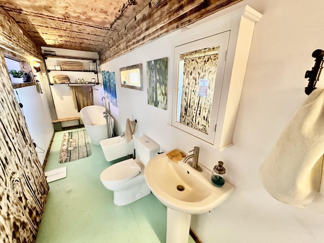 bathroom with sink, brick ceiling, a tub, and toilet