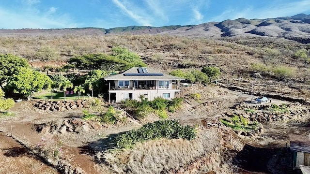 birds eye view of property featuring a mountain view