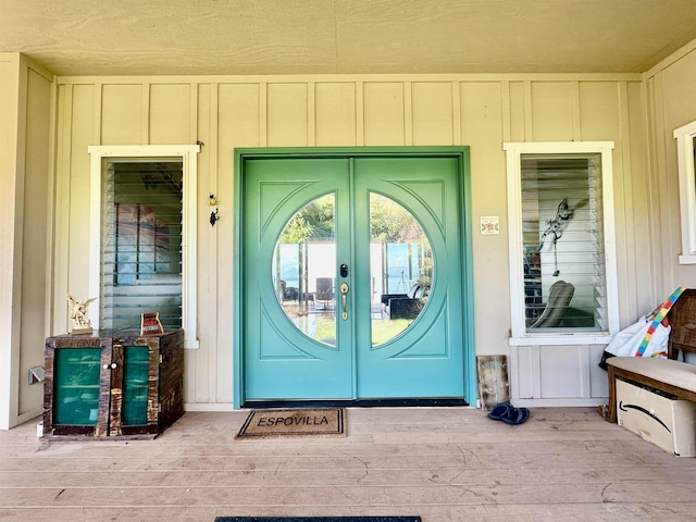 view of exterior entry featuring french doors