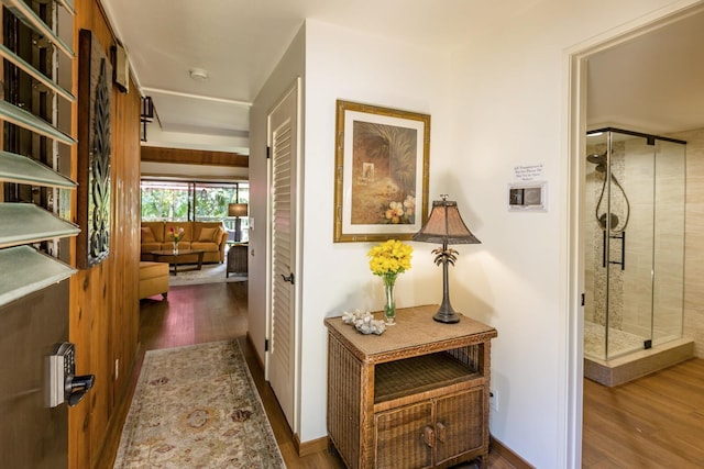 corridor featuring dark hardwood / wood-style flooring