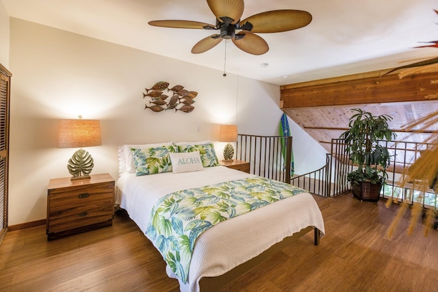 bedroom with ceiling fan, a closet, and dark hardwood / wood-style floors