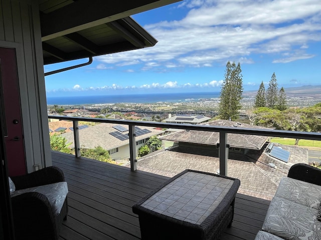 wooden deck featuring a water view