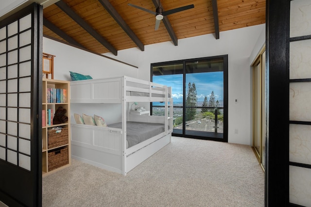 unfurnished bedroom featuring light carpet, vaulted ceiling with beams, ceiling fan, and wooden ceiling