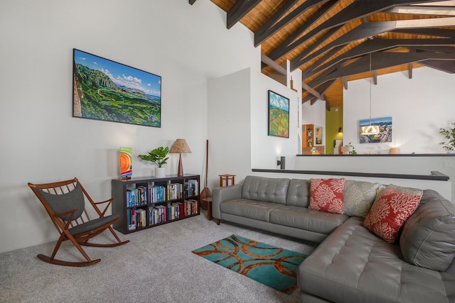 carpeted living room featuring vaulted ceiling with beams and wood ceiling