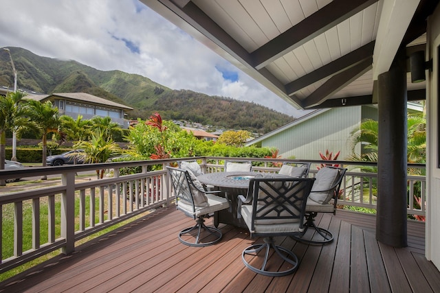 wooden deck with a mountain view