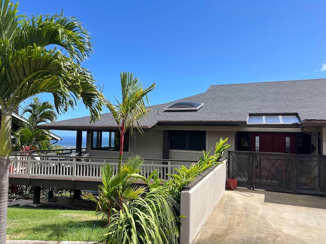 view of front of property with a wooden deck