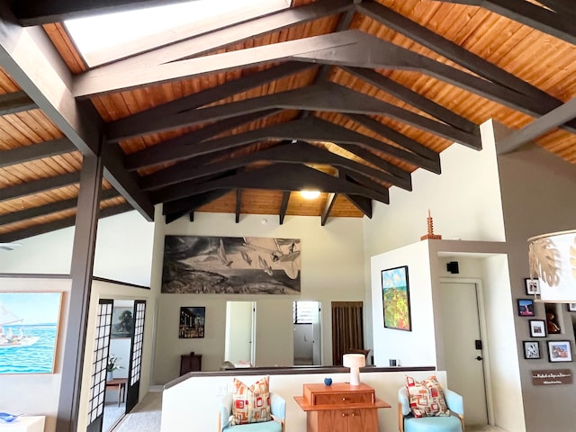 living room with lofted ceiling with skylight and wooden ceiling