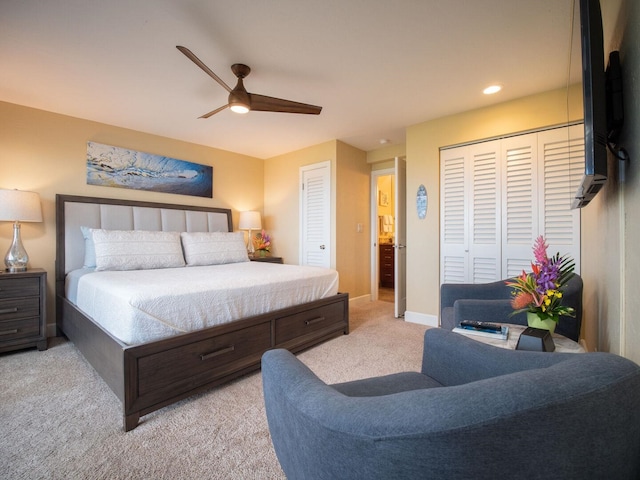 carpeted bedroom featuring two closets and ceiling fan