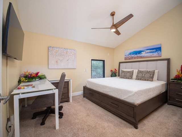 carpeted bedroom with vaulted ceiling and ceiling fan