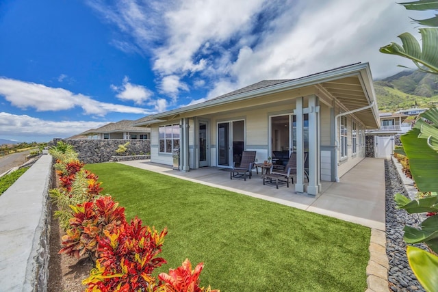 back of property featuring a patio area